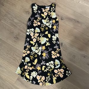 Jersey knit sleeveless dress, floral print with black ground